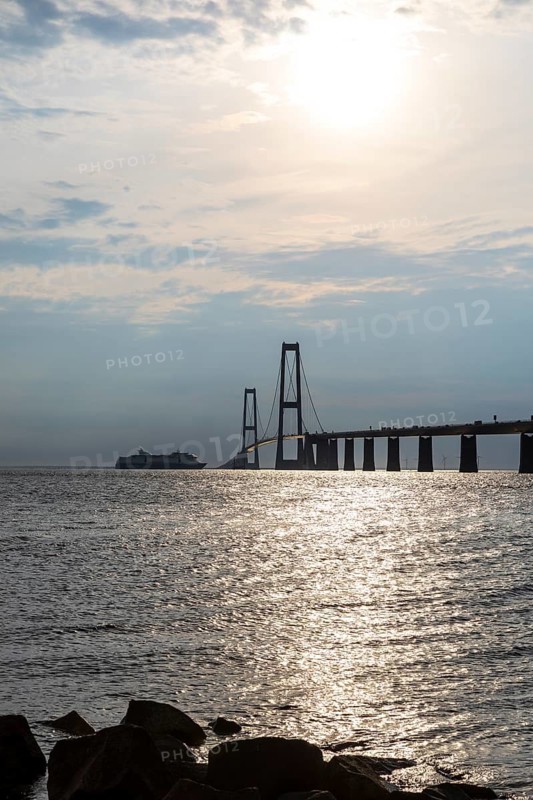 Large Color Line ferry crossing the Storebelt Bridge seen from Halsskov Odde viewpoint, East Bridge, Denmark