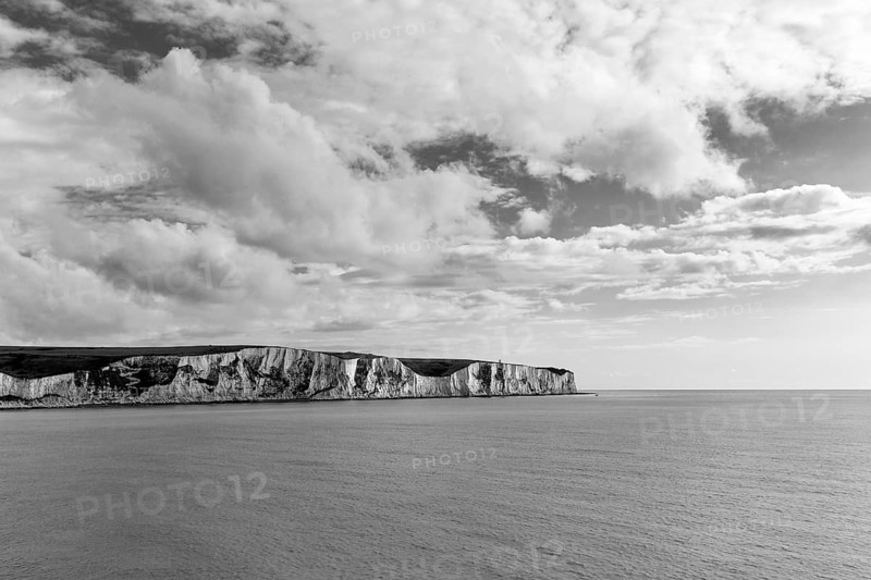 Chalk coast on the horizon, white cliffs by the sea, monochrome, Dover, Kent, England, Great Britain