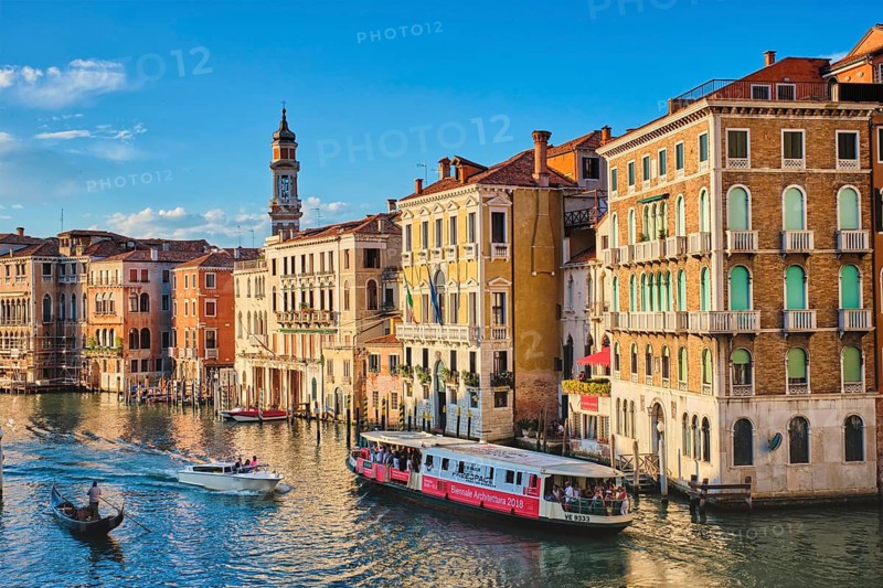 VENICE, ITALY, JUNE 27, 2018: Grand Canal with boats, vaporetto and gondolas on sunset from Rialto bridge, Venice, Italy