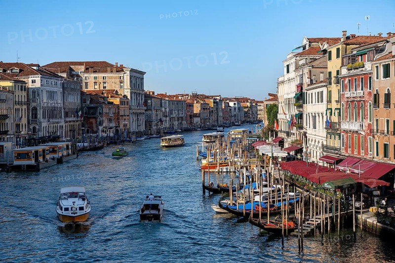 View of the Grand Canal with water taxis and vaporetto in the evening light, view from the Rialto Bridge, Venice, Veneto, Italy