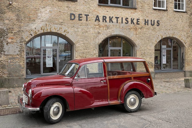 Vintage car parked in front of the cultural centre The Arctic House or Det Arktische Hus, Christianshavn district, Copenhagen, Denmark