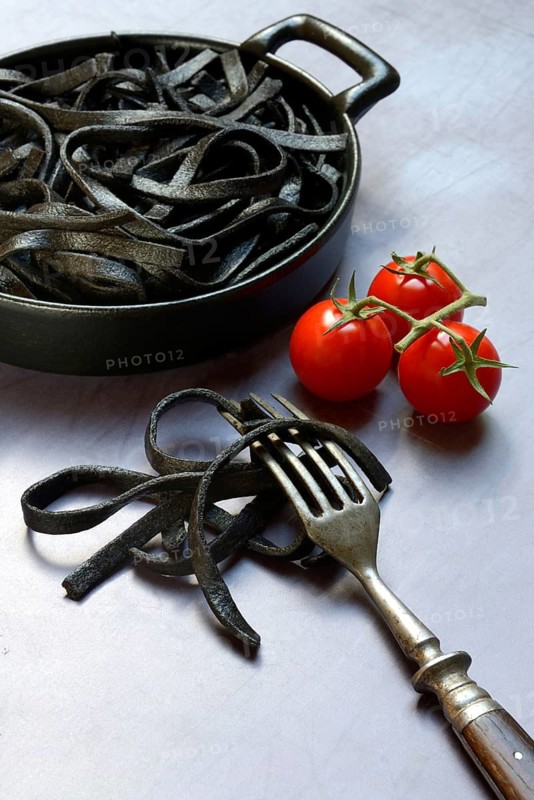 Black pasta coloured with squid ink in shell, Taglioni al Nero di Seppia, Italy