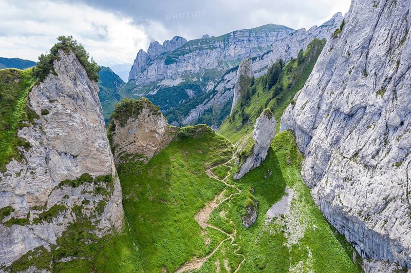 Hiking path in the Alpstein mountain range, from Wasserauen to Mesmer guest house, drone shot, Switzerland