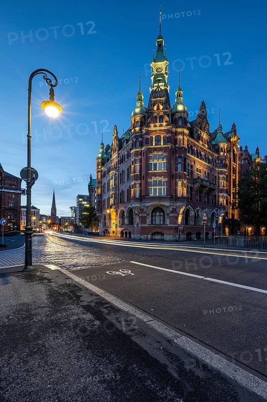 Speicherstadtrathaus in Speicherstadt with road traffic at the blue hour, Hamburg, Germany