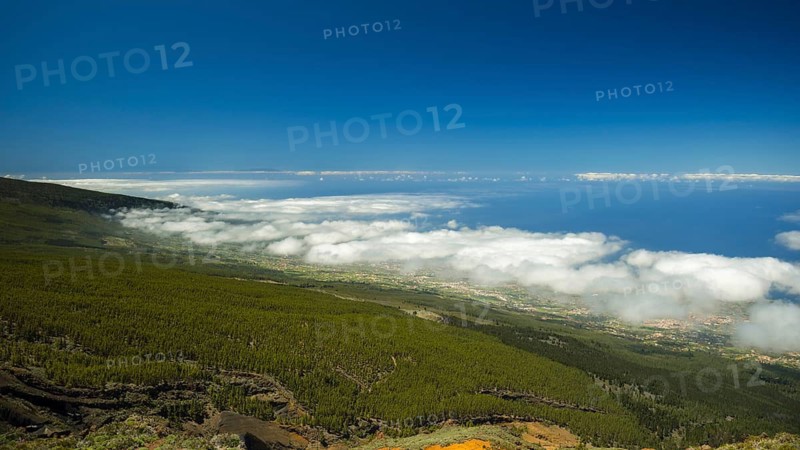 Panorama of the west coast with trade wind clouds from the Mirador El Valle viewpoint, Parque Nacional de las Canadas del Teide, Teide National Park, UNESCO World Heritage Site, Tenerife, Canary Islands, Spain