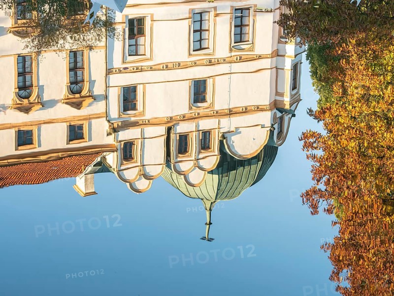 Celle Castle, Celler Schloss, tower of castle mirrored in the castles pond, Celle, Germany