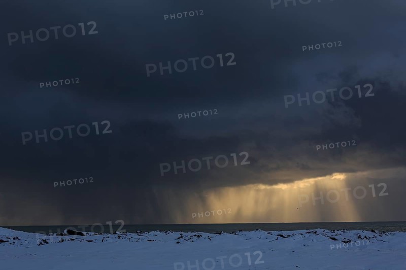 Cloudy mood and snowstorm over the sea, snow, winter, Snaefellsnes, Vesturland, Iceland