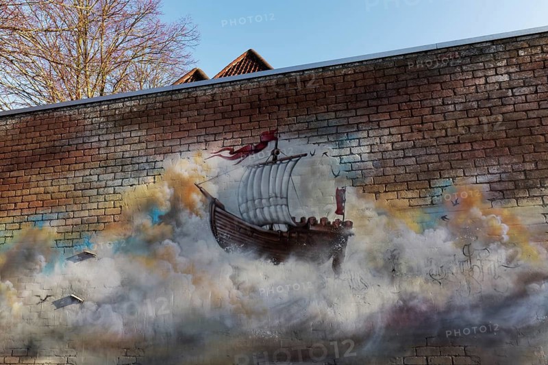 Historic sailing ship, cog, floating in a cloud, graffiti on a brick wall, Bruges, West Flanders, Flanders, Belgium