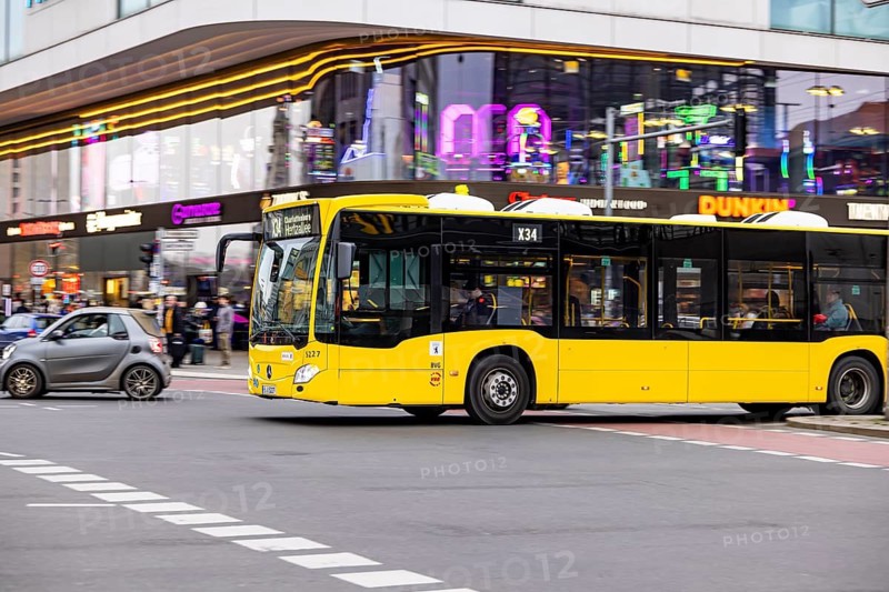 City view of Berlin in the evening. BVG public bus on Hardenbergstraße at Zoofenster. Berlin, Germany