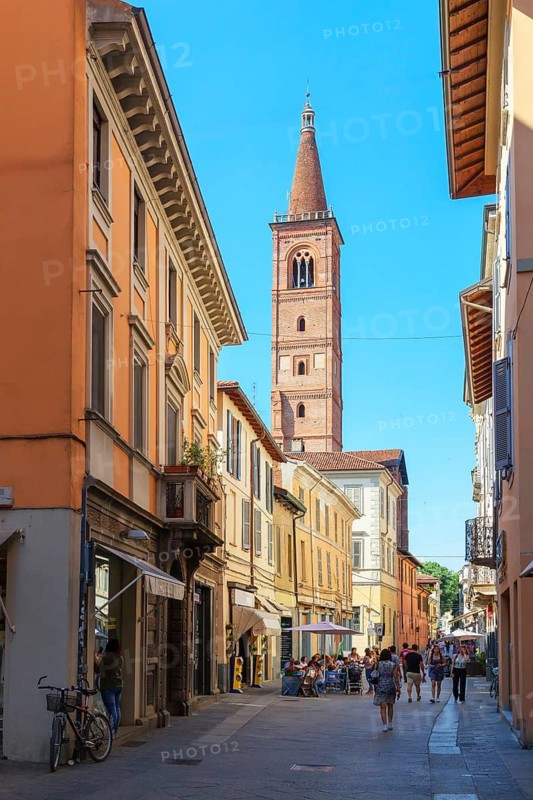 Old town street leading to Santa Maria del Carmine church, Pavia, Lombardy, Italy