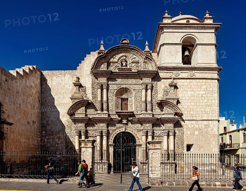 Baroque church with an elaborate stone façade under clear blue sky in Arequipa, A church in Arequipa in Peru