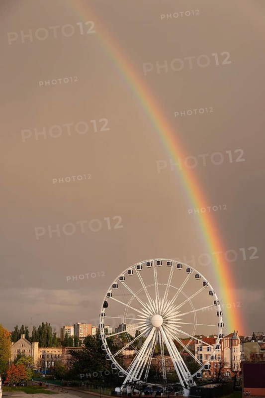Ferris wheel with rainbow near the Philharmonic Hall in Gdansk, Poland