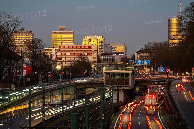Motorway A40, Ruhr expressway, heavy traffic jam, rush hour, city passage in Essen, skyline of the city centre, underground line between the lanes, Hobeisenbrücke stop, North Rhine-Westphalia, Germany