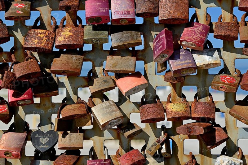 Lattice with rusty love locks, North Sea, Norddeich, Lower Saxony, Germany