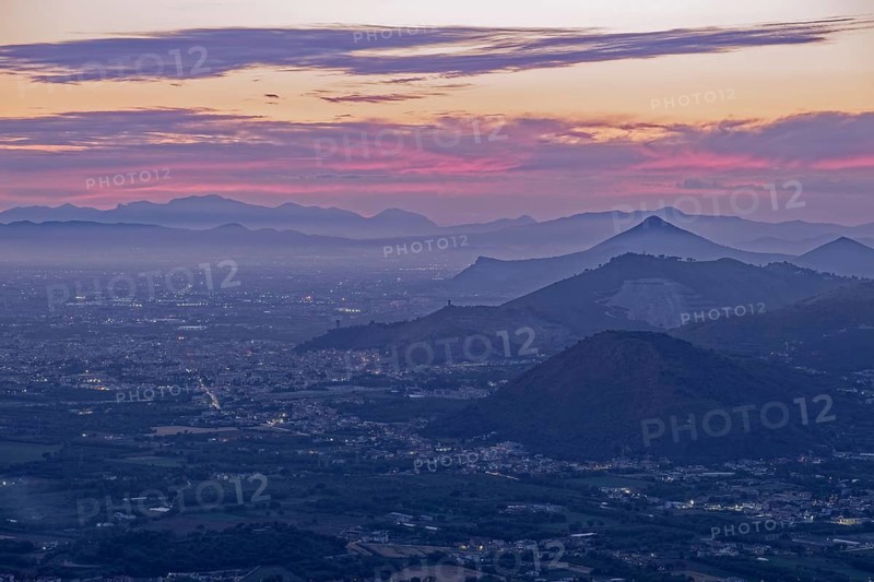 View of the densely populated Neapolitan region and the mountains near Caserta at dusk. San Felice a Cancello, Caserta, Campania, Italy, Southern Europe