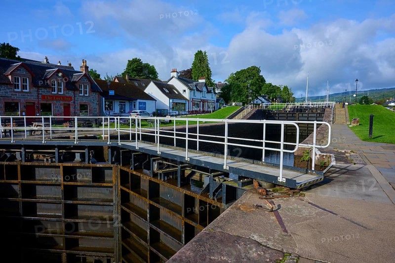 Picturesque lock in a village with houses and clouds in the blue sky, Caledonian Canal, Fort Augustus, Loch Ness, Scotland, United Kingdom, Great Britain