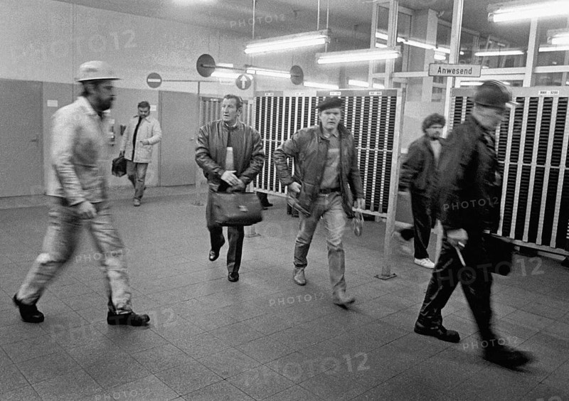 After work, workers from the Zollverein coking plant leave their work gap at the end of the shift. The coking plant was discontinued in 1993. Together with Zollverein Colliery, the former coking plant was declared a World Heritage Site by UNESCO in 2001, Essen, Germany
