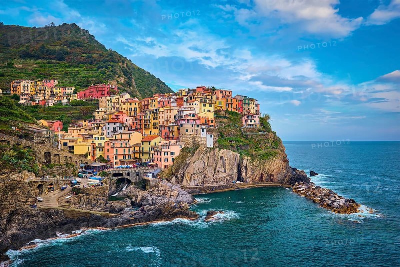 Manarola village popular european italian tourist destination in Cinque Terre National Park UNESCO World Heritage Site, Liguria, Italy on sunset