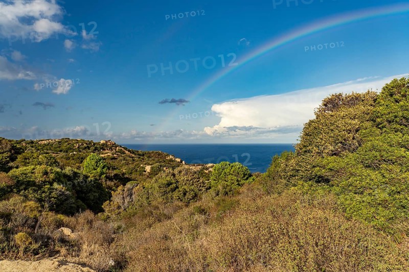 Rainbow over the coast near Calvi, Balagne, Corsica, France