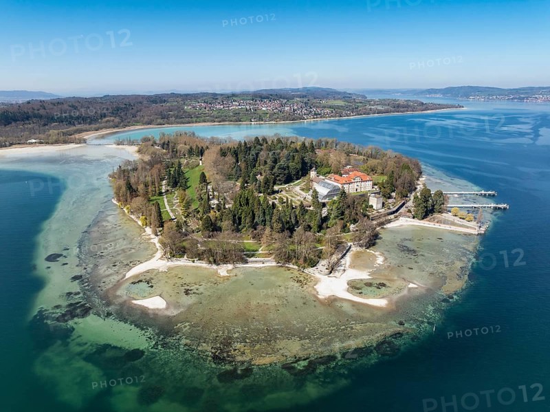 Aerial view of the island of Mainau at low tide with spring-like vegetation, on the horizon the village of Litzelstetten and the Bodanrück, district of Constance, Baden-Württemberg, Germany