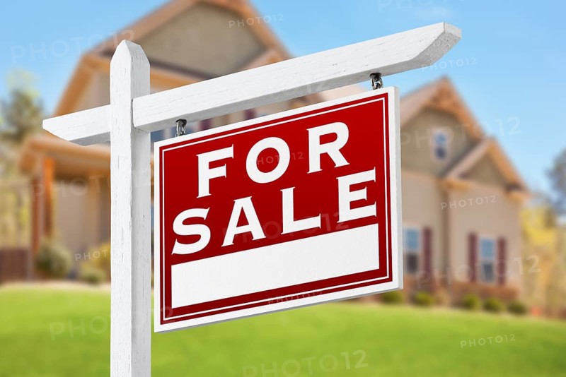 Home For Sale Real Estate Sign in Front of Beautiful New House