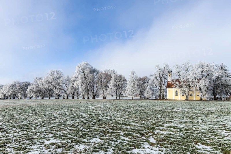 A frosty landscape with a small church in a wide field, Maria Schnee Chapel, Nassenbeuren, Unterallgäu, Bavaria, Germany