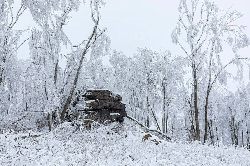Rock formation with hoarfrost and snow on the summit of the Czorneboh, Lusatian Mountains, Upper Lusatia, Saxony, Germany