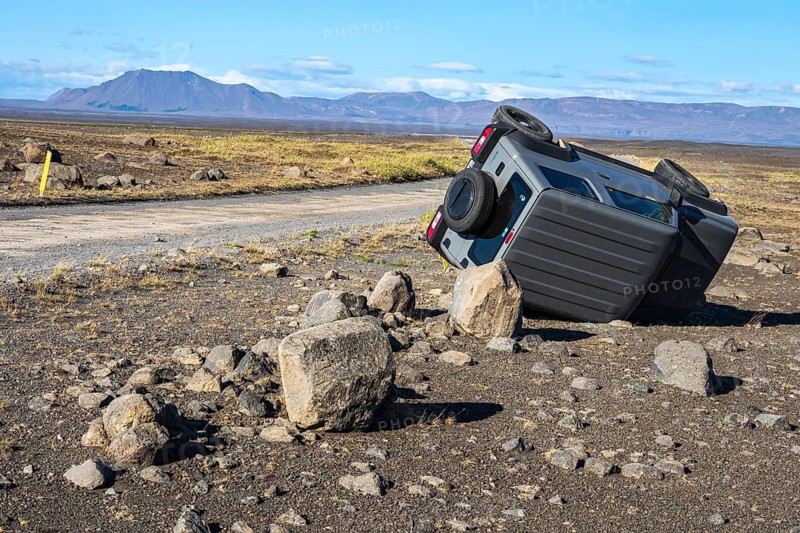 Crashed car, lying on its side, road 864 connecting ring road no.1 with eastern side of Dettifoss waterfall, Iceland