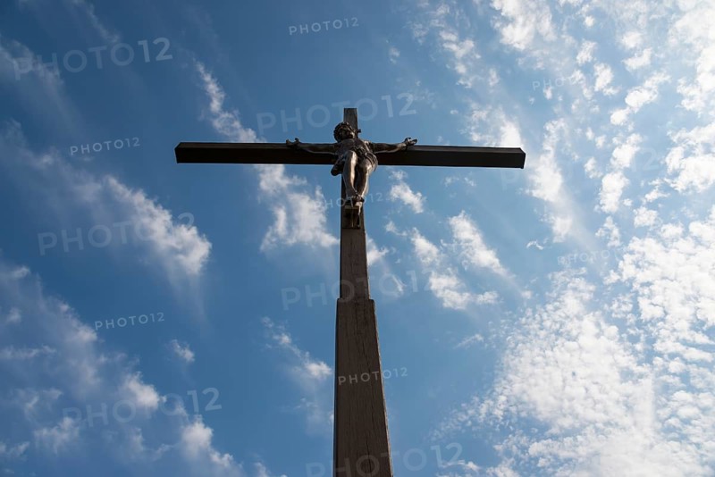 View of a cross with a statue of Christ against a cloudy sky, Wysoka Górka, Wysoka Gorka, Chelmska Hill, Chelmska, Chelm, Chelm, Cholm, Lublin Voivodeship, Poland