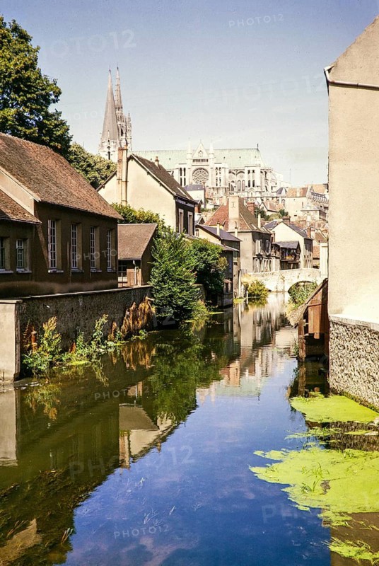 View of the river Eure and the cathedral church of Chartres, France 1964