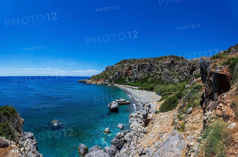 Excursion boat at Preveli Beach at the end of the Kourtaliatiko Gorge, south coast, Crete, Greece