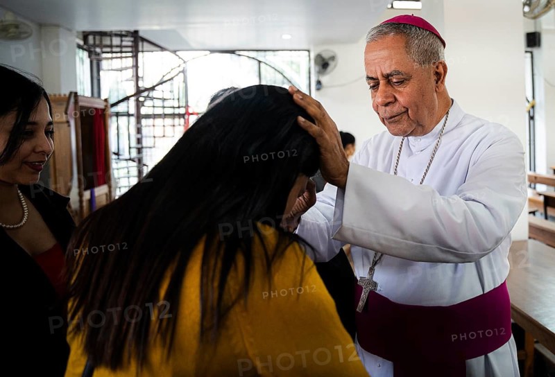 Archbishop John Moolachira gives blessing to a devotee after prayer during a Christmas day sermon on December 25, 2024 in Guwahati, India. Christmas is a festive holiday celebrated on December 25th, marking the birth of Jesus Christ in Christian tradition.