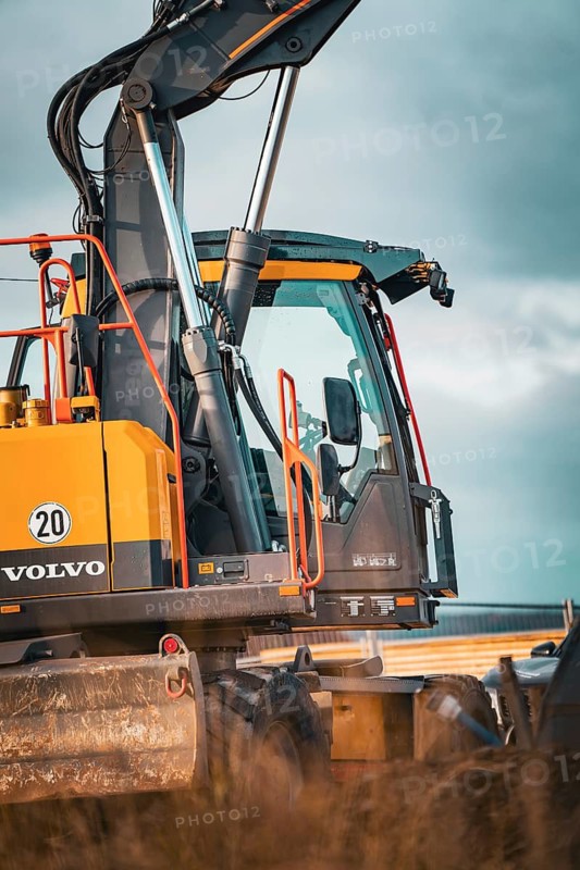 Yellow Volvo tracked excavator on construction site