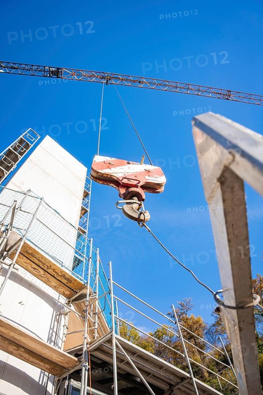 Detailed view of a crane and structures on a construction site in front of a blue sky, ZOB Calw reconstruction for Hermann Hessebahn, Calw, Black Forest, Germany