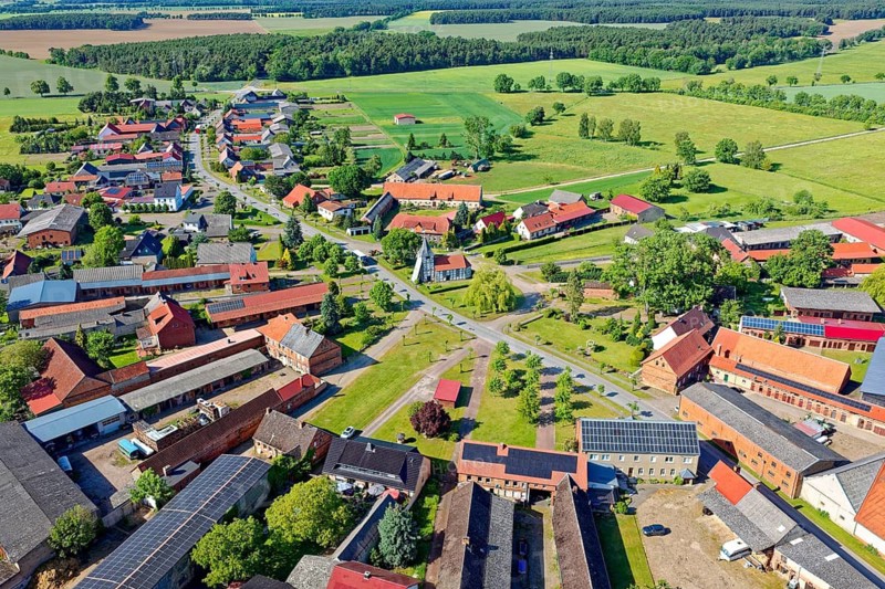 The town center of Wenze, a round town, is grouped around the town center. There is the village church, a half-timbered church from 1736, which, although supported, has not yet been completely restored. The town is located on the edge of the Drömling Saxony-Anhalt UNESCO Biosphere Reserve. aerial view. Wenze, Klötze, Altmark-Salzwedel District, Saxony-Anhalt, Germany