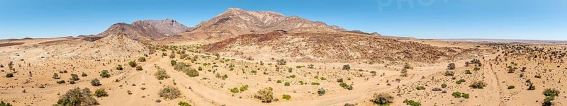Aerial view, dry riverbed and desert landscape on the Ugab River, behind Brandberg, Erongo, Damaraland, Namibia
