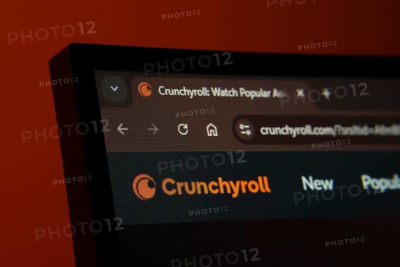 Dhaka, Bangladesh- 02 June 2025: Close-up of a computer screen displaying the Crunchyroll web interface in dark mode