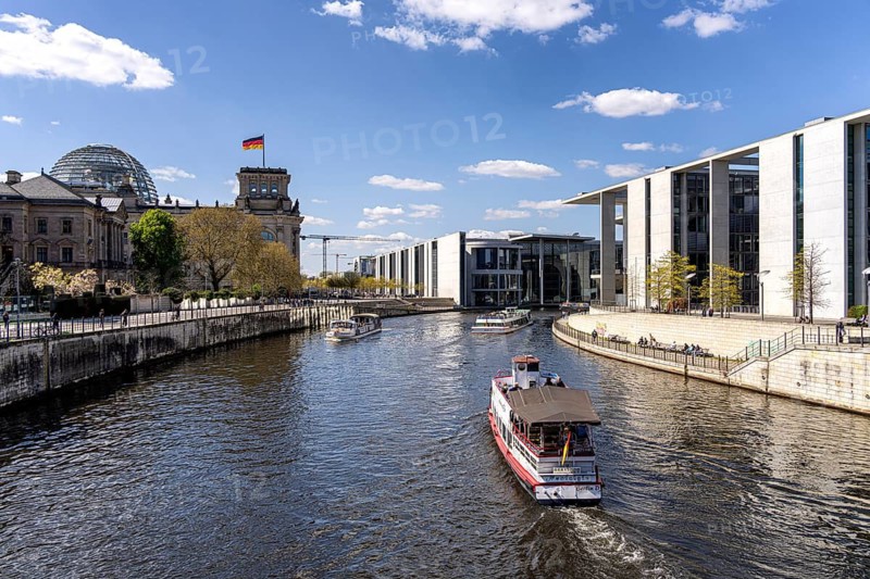 Excursion boat trip on the Spree in Berlin's government district along the Reichstag and the rear house façade of the Marie-Elisabeth-Lüders House, Berlin, Germany