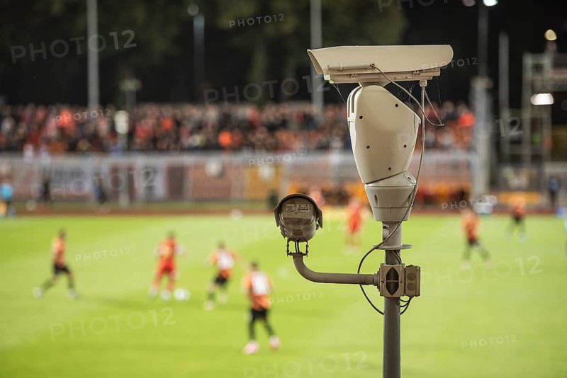 CCTV camera at football stadium with match in the background. Lubin, Poland