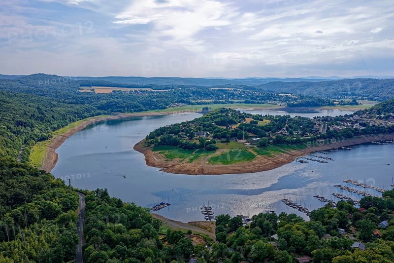 The Eder river loop around the village of Scheid, Rehbach in the foreground, in the Kellerwald-Edersee nature park Park in northern Hesse. aerial view. Edertal, Hesse, Germany