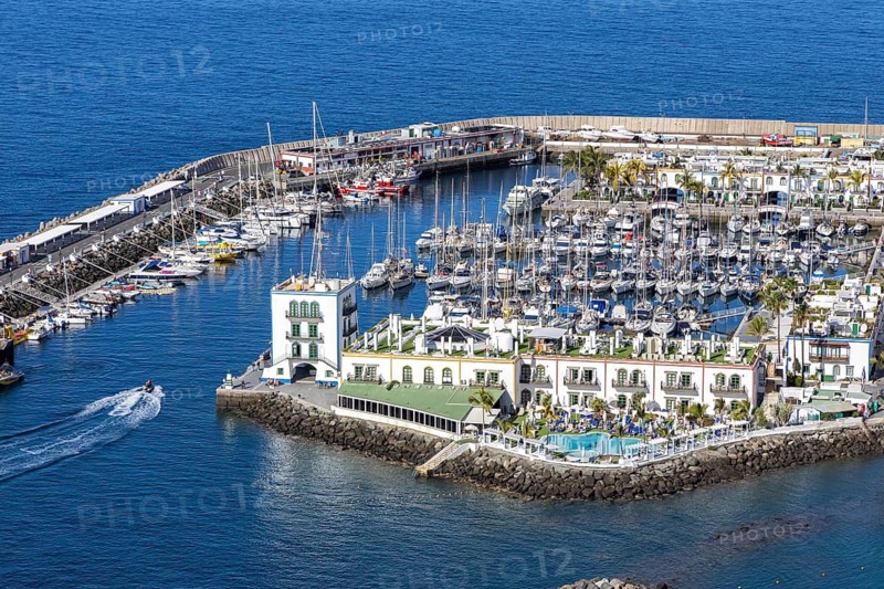 Puerto de Mogan in Gran Canaria from above Marina with boats seaside vacation trip in Puerto de Mogán, Spain