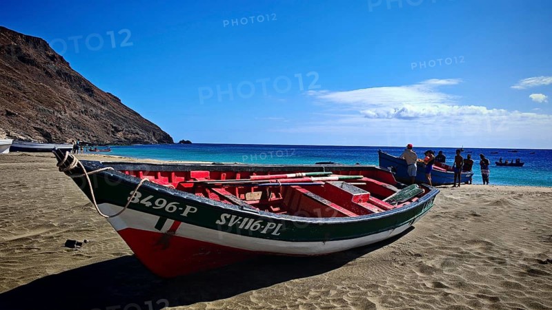 Two colorful boats are lying on the beach, with several people standing around a boat, hiking, Sao Pedro, Sao Vicente, Cabo Verde, Cape Verde, Cape Verde