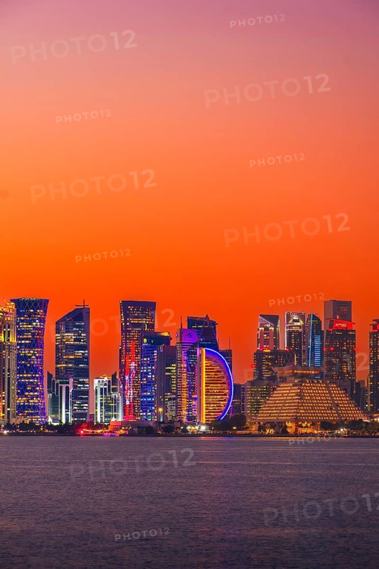 Doha, Qatar - january 8th, 2026: Doha skyline at night from the Corniche. Iconic illuminated skyscrapers business district luxury middle east gulf colorful night architecture