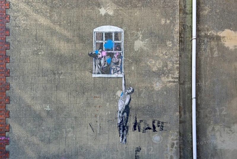'Well Hung Lover' Frogmore Street, city centre of Bristol, England, UK partially defaced artwork by Banksy 2006