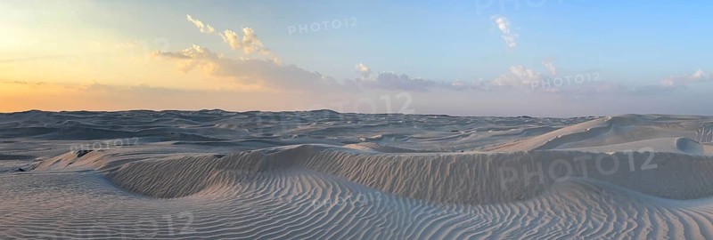 Sunset, white sand dunes in the Khaluf desert, Oman