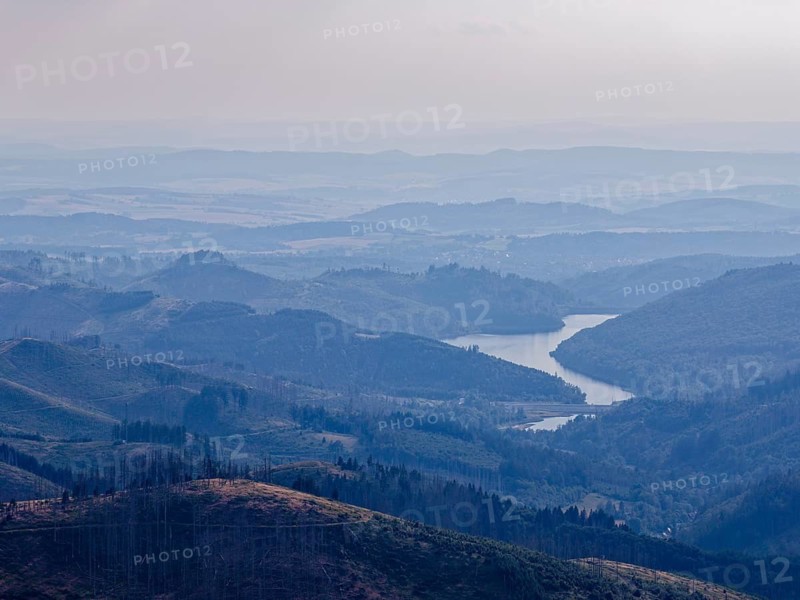 Mountain landscape in the Harz nature park Park, evening haze over the valleys, and in the Sösestausee valley. aerial view. Harz, Landkreis Goslar, Lower Saxony, Germany