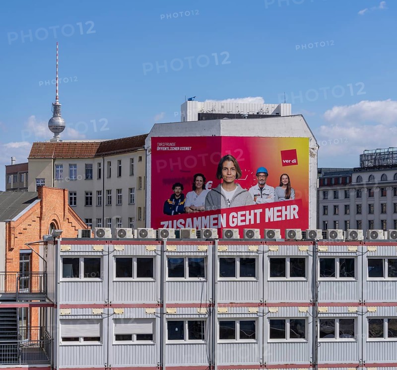 Oversized Verdi advertisement on a house façade on Schiffbauerdamm, Berlin, Germany