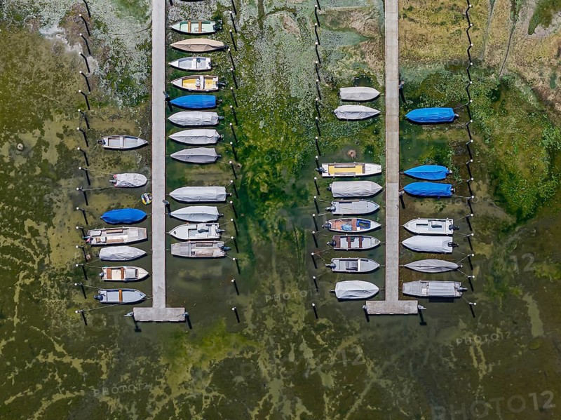 Drought on Lake Constance. The marina of Mannenbach-Salenstein in the canton of Thurgau is almost completely dry. Boats are dry at the dock and can no longer get into the water. aerial view. Mannenbach-Salenstein, Canton of Thurgau, Switzerland