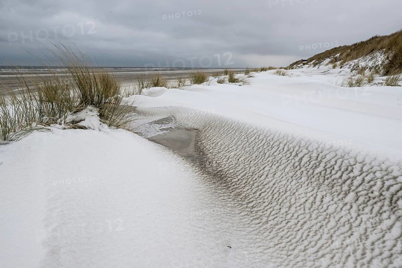 Snow-covered dunes on the North Sea beach, Langeoog, Lower Saxony, Germany