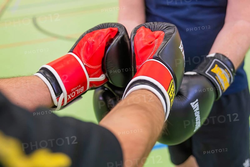 Close-up of two people pressing their gloves together during boxing practice, Boxing TSV Calw, Germany